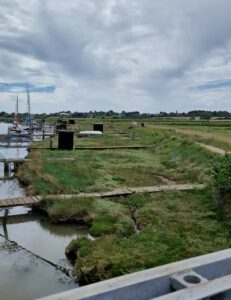 Riverside path along Southwold harbour. Dog friendly oliday cottages on the Suffolk Coast
